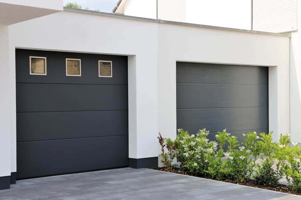 Residential overhead door repair Calgary technician inspecting hardware
